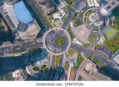 Aerial View Of A Roundabout With Skyscraper And High-rise Office Buildings In Shanghai Downtown, China. Financial District And Business Centers In Smart City In Asia. Top View