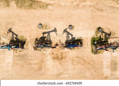 Aerial view of the row of oil derricks in summer