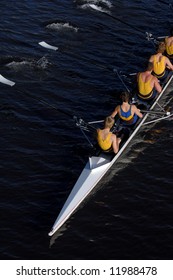 an aerial view of a rowing crew in action.