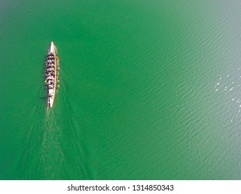 Aerial View Of Rowing Team On Water