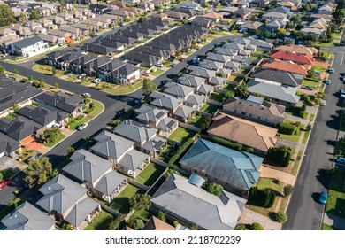 Aerial view of rows of detached houses built during the 2010s in outer suburban Sydney, Australia.