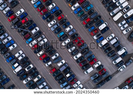 Aerial view of rows of parked cars lined up for sale for export and import tariffs to America
