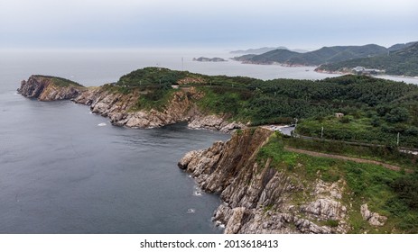 Aerial view of the rugged coastline along the Mao’tou Mountain in Wei’hai, Shan’dong Province, China. The photo was shot on a cloudy day in July.