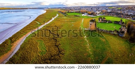 Aerial view of ruins of Flint castle in Flintshire, Wales, lying on the estuary of the River Dee, UK