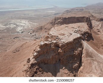 Aerial view of ruins of fortress Masada National Park, Southern District of Israel. Ancient fortification built by Herod the Great on a cliff-top off the Dead Sea coast. In UNESCO World Heritage List - Shutterstock ID 2150088257