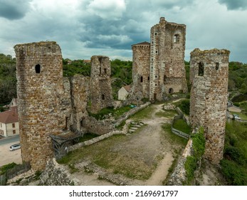 Aerial view of the ruins of Herisson fortress of the Dukes of Bourbon dominate the medieval city of Hérisson and Aumance Valley with towers standing tall in the inner castle in central France