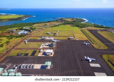 Aerial view of the runway and plane hangars of Lihue airport on Kauai island, Hawaii, United States