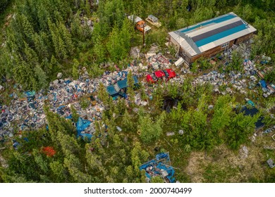 Aerial View Of A Rural Hoarder House Overflowing With Garbage