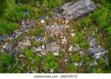 Aerial View Of A Rural Hoarder House Overflowing With Garbage