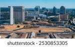 Aerial view of Sacramento, California, featuring the Sacramento Valley Station, Wells Fargo Center, and US Bank Tower amidst urban and natural elements.