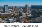 Aerial view of Sacramento, California, highlighting modern skyscrapers like Wells Fargo Center and the iconic California State Capitol dome.