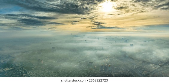 Aerial view of Saigon cityscape at morning with misty sky in Southern Vietnam. Urban development texture, transport infrastructure and green parks - Powered by Shutterstock