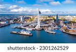 Aerial view of the sail-shaped Spinnaker Tower in Portsmouth Harbor in the south of England on the Channel coast - Gunwharf Quays modern shopping mall in a residential waterfront area