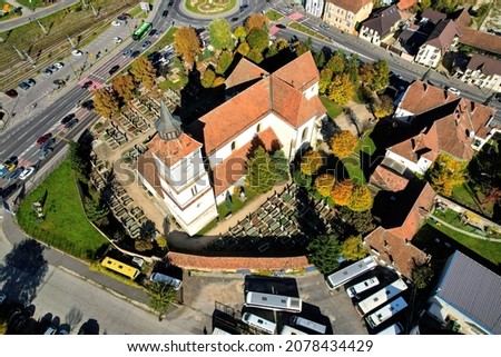 Aerial view of the Saint Bartholomew Evangelical-Lutheran church built in the 13th century, the oldest building in the city of Brasov, Romania. The surrounding walls also enclose a cemetery