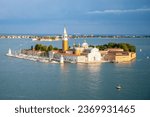 Aerial view of Saint George Island, Italian: Isola San Giorgio, with Campanile San Giorgio in Venetian Lagoon, Venice, Veneto Region, Italy. Photography on sunny summer day