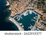 Aerial view of Saint Tropez with Mega Yachts and Sail boats getting ready for racing on Regatta Day