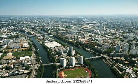 Aerial view of Saint-Denis involving the Seine River and famous Stade de France stadium to the north of Paris, France - Shutterstock ID 2323688841