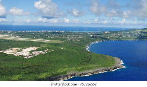 Aerial View Of Saipan International Airport Runway And Lau Lau Bay Seen From The Window Of An Airplane 