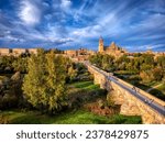 Aerial view of Salamanca with the cathedral in the background and the roman bridge in the foreground.