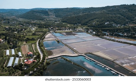 Aerial view of salt flats in Strunjan, coastal city in Slovenia. Original salt production in the Slovenian seaside. - Powered by Shutterstock