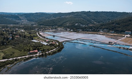 Aerial view of salt flats in Strunjan, coastal city in Slovenia. Original salt production in the Slovenian seaside. - Powered by Shutterstock