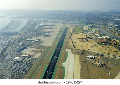 Aerial view of the San Diego International Airport, river and pacific ocean, in Southern California. Lindbergh Field is the busiest single runway commercial airport in the United States of America.