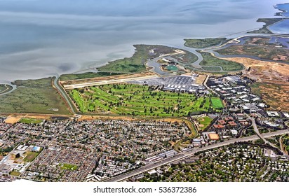 Aerial view of San Francisco bay area in California United States of America scenery with city of Palo Alto airport golf course Brentwood academies harbor 101 root bayshore freeway satellite landmark - Powered by Shutterstock