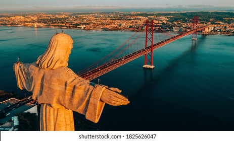 Aerial view of Sanctuary of Christ the King, Santuario de Cristo Rei. Lisbon, Portugal. Drone photo at sunrise. Catholic monument