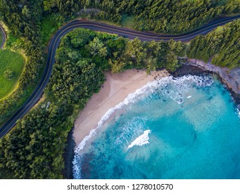 Aerial View Of The Sandy Beach And Curved Asphalt Road On The West Coast Of Maui. Hawaii