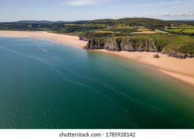 Aerial view of the sandy beaches of the Gower coastline in Wales, UK (3 cliffs and Oxwich Bay)