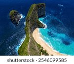 aerial view of sandy shoreline with blue waters