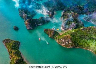 Aerial view of Sang cave and Kayaking area rock island, Halong Bay, Vietnam, Southeast Asia.UNESCO World Heritage Site. Junk boat cruise to Ha Long Bay. Popular landmark, famous destination of Vietnam