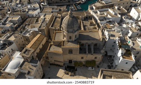 Aerial view of Santa Teresa church located in Monopoli, in the province of Bari, Apulia, Italy. It is a eighteenth-century church, with a beautiful dome, in the historic center of the town. - Powered by Shutterstock