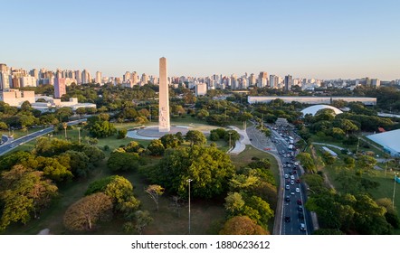 Aerial View Of Sao Paulo City And  Next To Ibirapuera Park. Prevervetion Area With Trees And Green Area Of Ibirapuera Park  In Sao Paulo City,  Brazil.