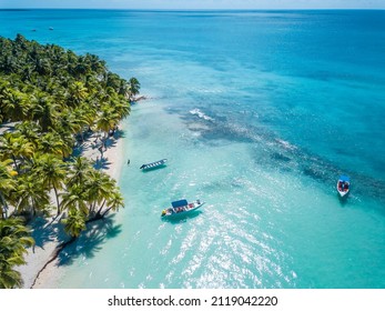 Aerial view of Saona Island in Dominican Republuc. Caribbean Sea with clear blue water and green palms. Tropical beach. The best beach in the world. - Shutterstock ID 2119042220