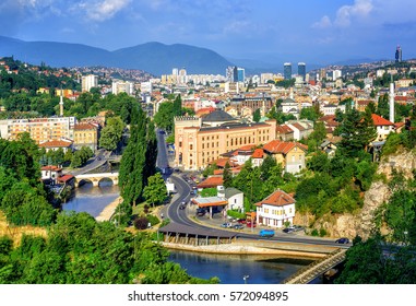 Aerial view of Sarajevo, the capital of Bosnia and Herzegovina, with Latin Bridge, Miljacka River, National Library and the modern city