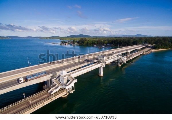 Aerial\
view of Sarasin Bridge, the bridge is the most important in making\
businesses. From the provinces to Phuket Has traded a lot of money.\
This bridge linking the province of Phang\
Nga.