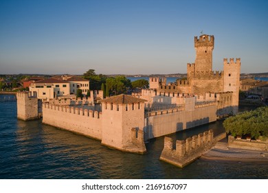 Aerial view of Scaligero Castle at sunrise. Sirmione aerial view on Lake Garda, Italy. Water castle on Lake Garda.