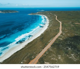 Aerial view of a scenic coastal road along turquoise waters and white sandy beach in Esperance, Australia. - Powered by Shutterstock