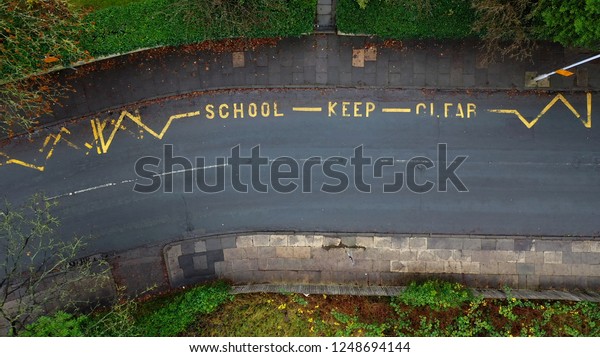 Aerial\
view of a school keep clear road sign in the\
UK