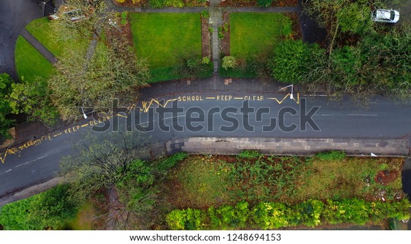 Aerial\
view of a school keep clear road sign in the\
UK