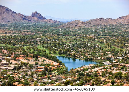 Aerial view from Scottsdale to Phoenix, Arizona above golf course and upscale homes