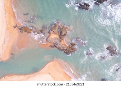 aerial view of sea and ocean waves near the beach Sea water hitting rocks on the beach Looks impressive, the beauty of the sea