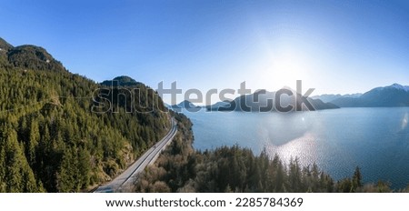 Aerial View of Sea to Sky Highway in Howe Sound. Sunset Sky. Between Squamish and Vancouver, BC, Canada. Panorama Background
