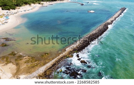 Aerial view of the sea stone breakwater. Beautiful ocean wallpaper for tourism and advertising. Asian landscape, drone photo Stock fotó © 