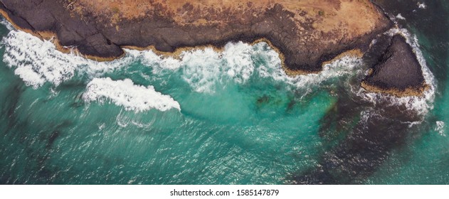 Aerial View Of  Sea Waves Breaking On Rocky Cliff, Adventure Summer Travel Vacation, Perseverance And Resilience, Hydropower Clean Renewable Energy, Decarbonisation Concept