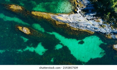 Aerial View Of Sea Waves And Fantastic Rocky Shore. Reefs And Algae Near The Shores Of The Norwegian Sea. Norway