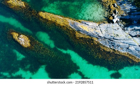 Aerial View Of Sea Waves And Fantastic Rocky Shore. Reefs And Algae Near The Shores Of The Norwegian Sea. Norway