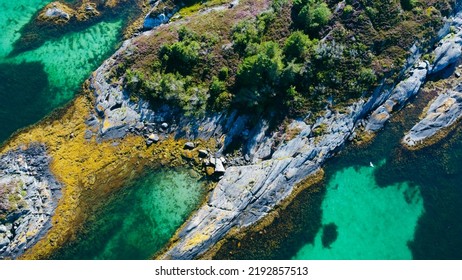 Aerial View Of Sea Waves And Fantastic Rocky Shore. Reefs And Algae Near The Shores Of The Norwegian Sea. Norway