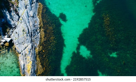 Aerial View Of Sea Waves And Fantastic Rocky Shore. Reefs And Algae Near The Shores Of The Norwegian Sea. Norway